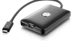 a black portable external hard drive with a short usb cable attached the device features a shiny logo in the center and has one usb port visible on the side digital production A black portable external hard drive with a short USB cable attached. The device features a shiny logo in the center and has one USB port visible on the side.