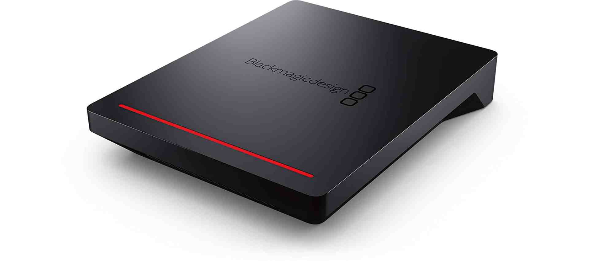 a sleek black external hard drive with a red led light digital production A sleek black external hard drive with a red LED light.