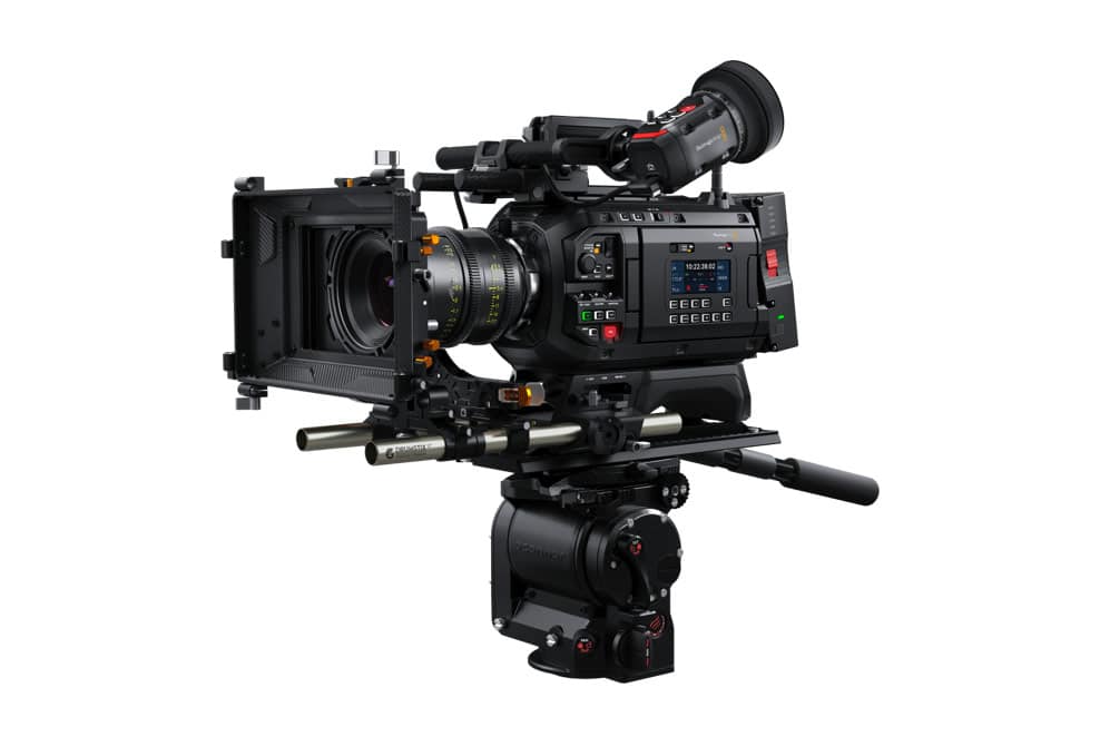 a professional video camera mounted on a tripod with a matte box and various controls the camera features a lens and an electronic viewfinder designed for film and video production digital production A professional video camera mounted on a tripod with a matte box and various controls. The camera features a lens and an electronic viewfinder, designed for film and video production.