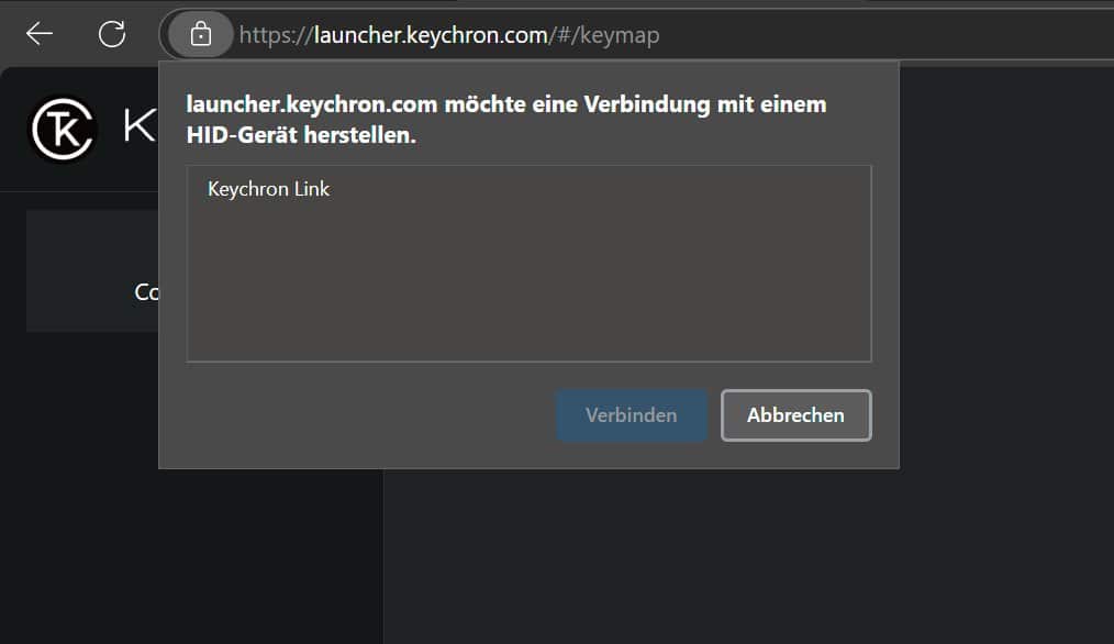 a browser window displaying a prompt asking for permission to connect to a hid device with text in german the prompt includes options to connect or cancel the background is dark featuring the keychron logo on the left digital production A browser window displaying a prompt asking for permission to connect to a HID device, with text in German. The prompt includes options to connect or cancel. The background is dark, featuring the Keychron logo on the left.