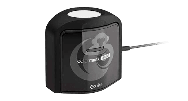 a color calibration device known as colormunki display with a black exterior and a circular sensor on top it is connected by a cable and positioned on a white background digital production A color calibration device, known as ColorMunki Display, with a black exterior and a circular sensor on top. It is connected by a cable and positioned on a white background.