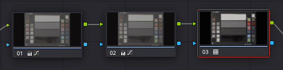 three video clips displayed in a timeline view of a video editing software with the third clip selected and highlighted in red the clips show a color chart on a blurred background digital production Three video clips displayed in a timeline view of a video editing software, with the third clip selected and highlighted in red. The clips show a color chart on a blurred background.