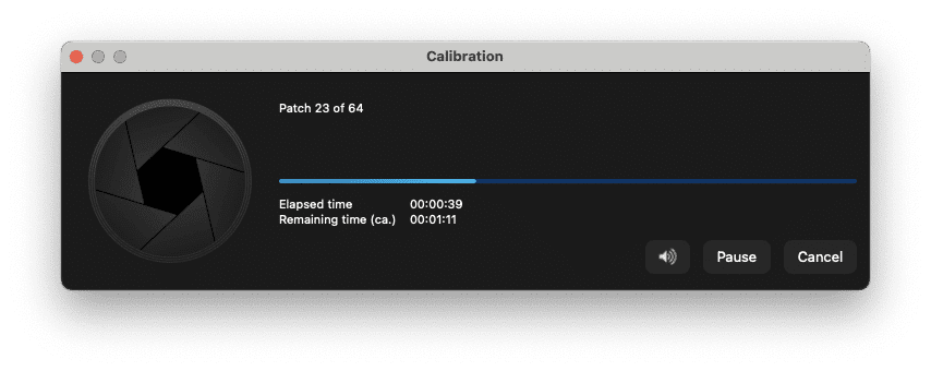 a calibration window on a computer screen displaying progress it shows patch 23 of 64 with a progress bar elapsed time is 39 seconds and remaining time is approximately 11 seconds options to pause or cancel are visible digital production A calibration window on a computer screen displaying progress. It shows 'Patch 23 of 64,' with a progress bar. Elapsed time is 39 seconds and remaining time is approximately 11 seconds. Options to pause or cancel are visible.