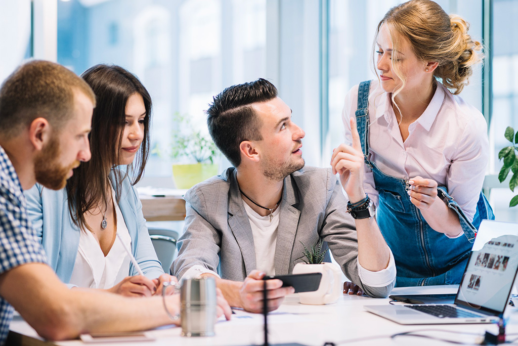 man-asking-colleagues-advice-in-the-office